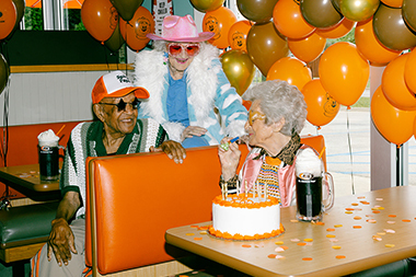 A&W centenarian customer enjoying a classic root beer float